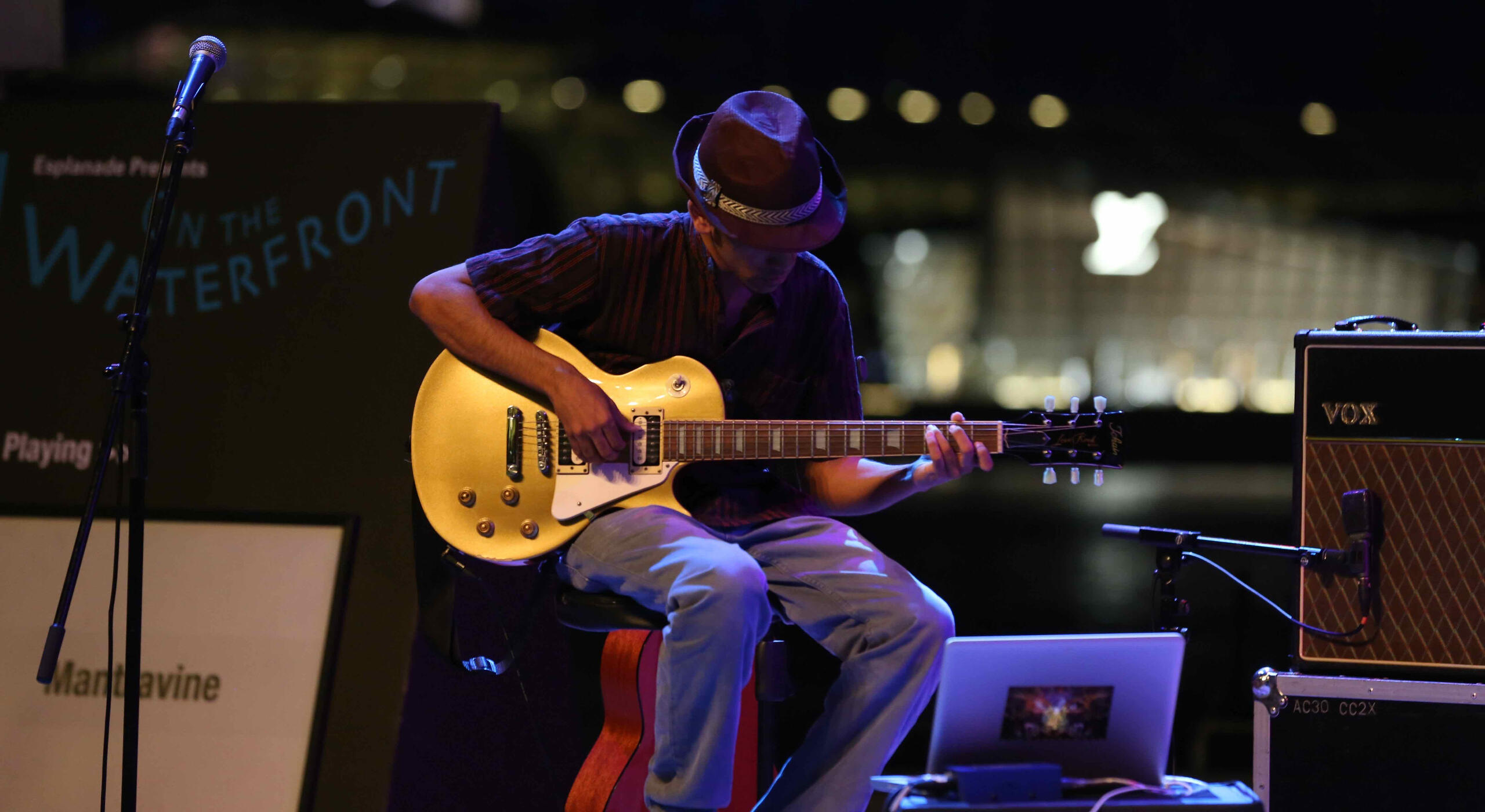 Guitar instructor teaching student at Newton location Singapore